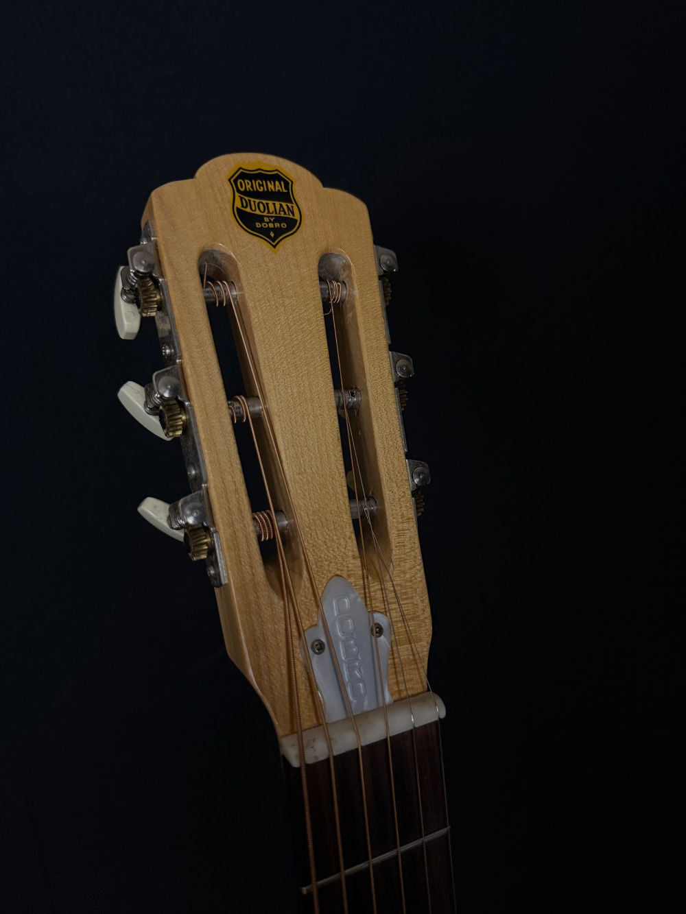 1991 Dobro DW90SC resonator guitar headstock. The logo reads "original duolian by dobro"