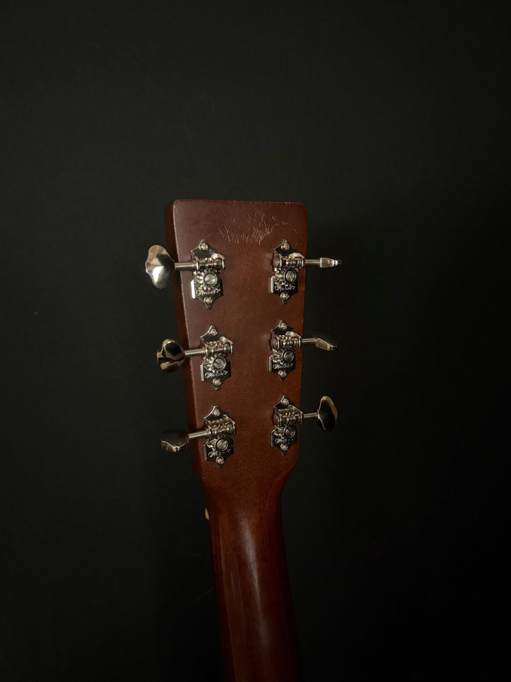2011 Martin 00015M acoustic guitar tuners and some light scratches on back of headstock