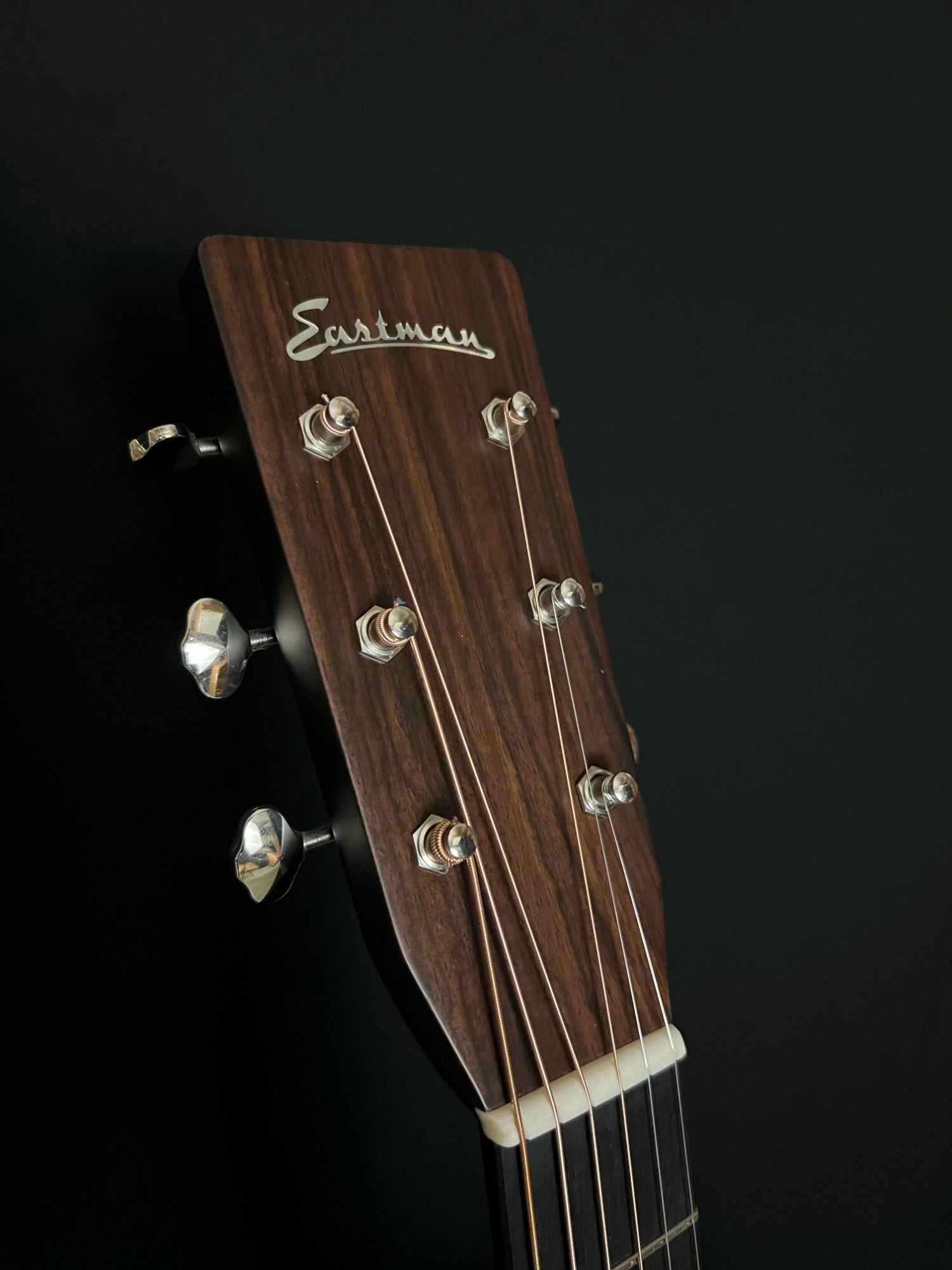 close up of headstock of Eastman E20OM-TC acoustic guitar