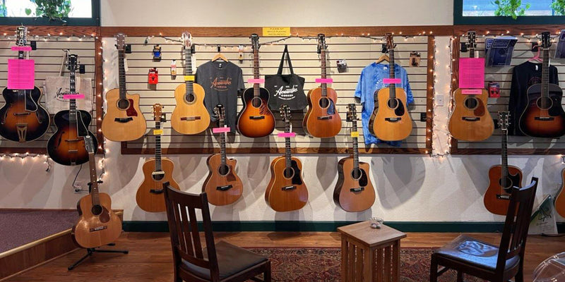 wall of vintage guitars at Acoustic Corner